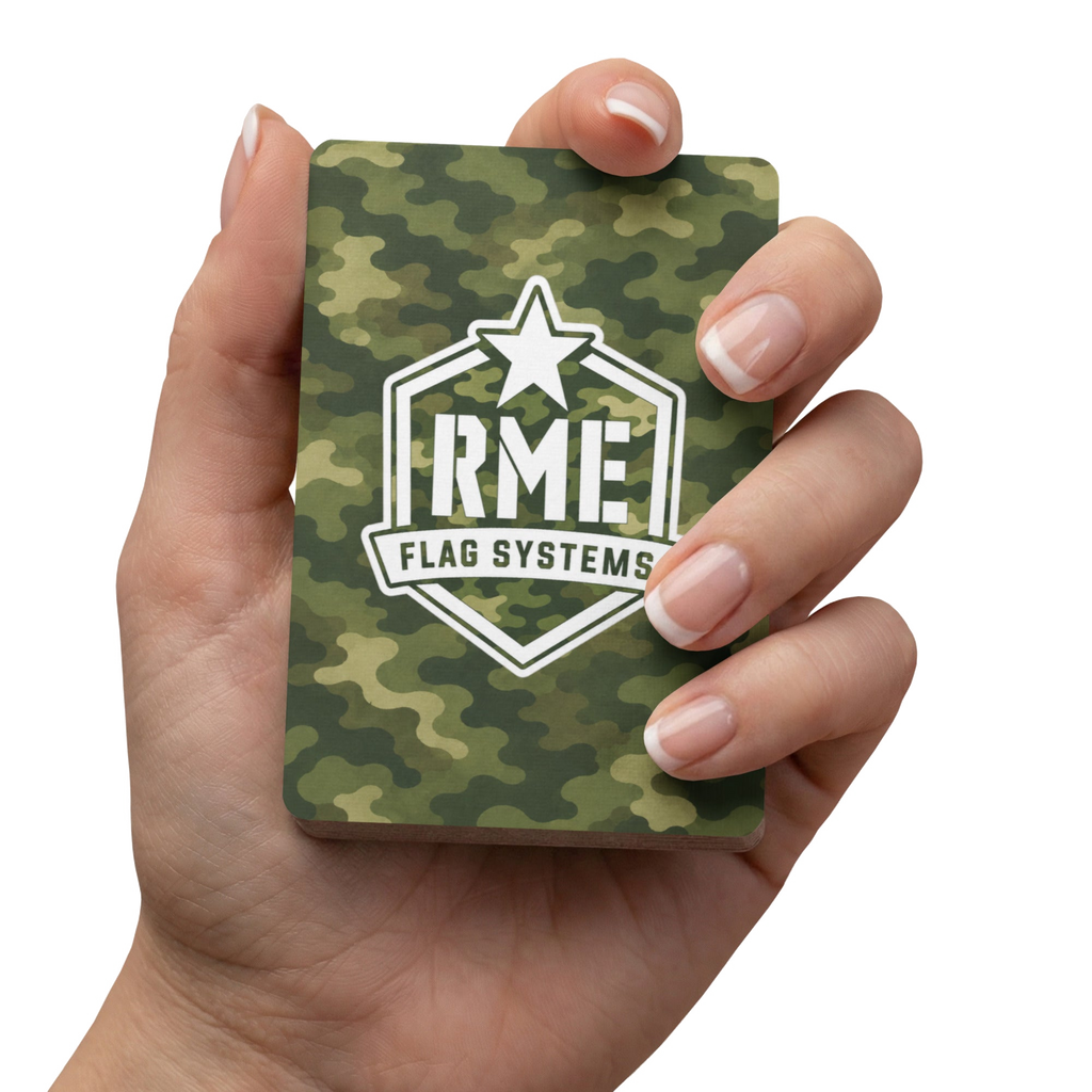RME Poker playing cards held in hand, front view